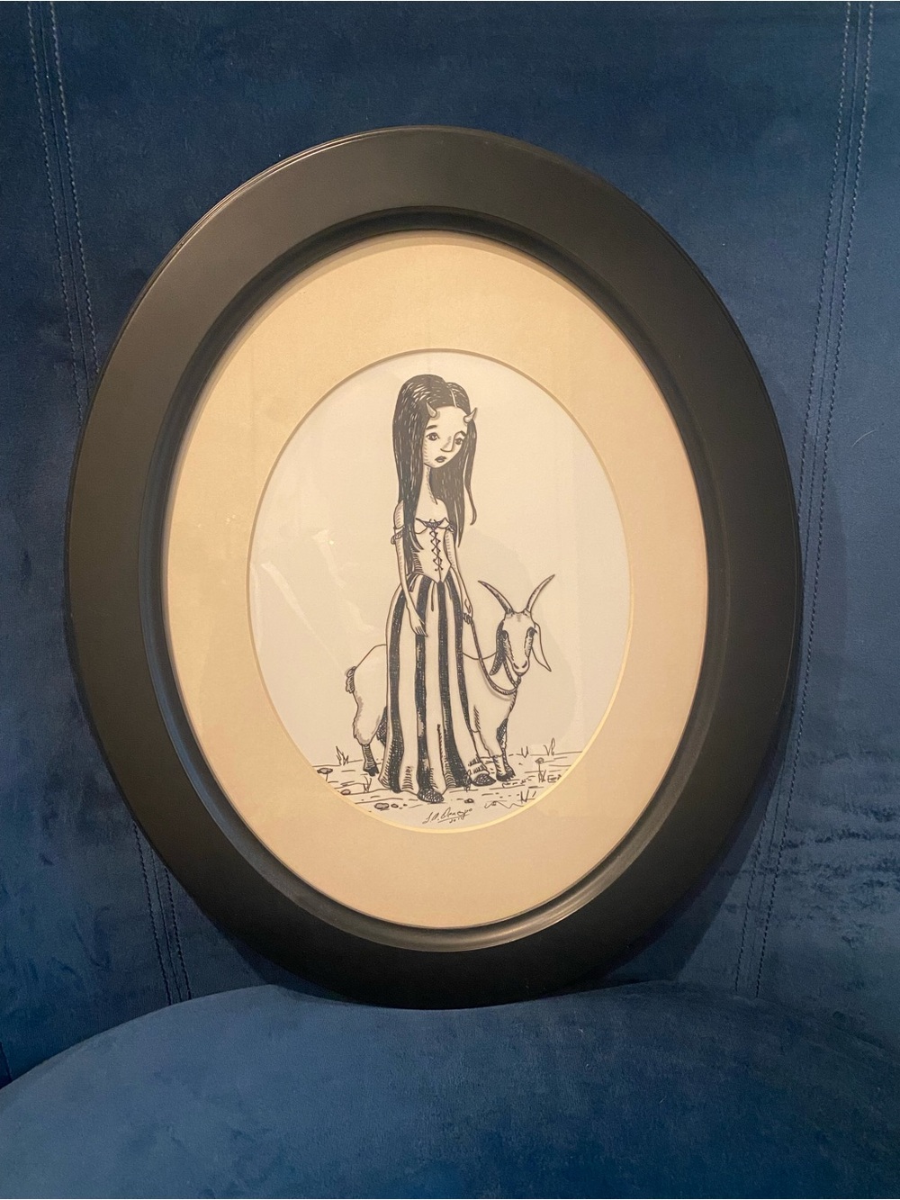 Oval Black Frame with Cream Mat and Whimsical Girl Illustration.